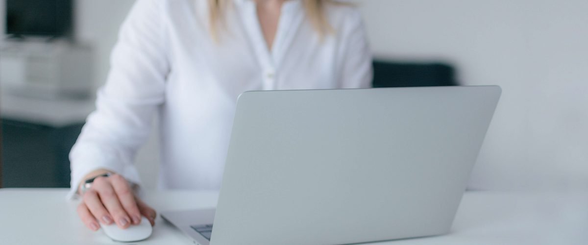 Woman using silver laptop