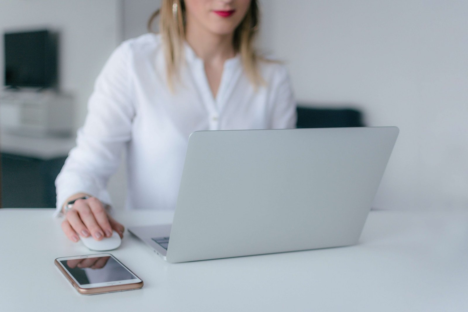 Woman using silver laptop